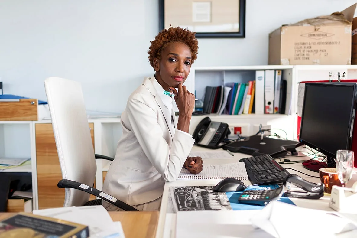 Businesswoman at her office desk, Barclays Cape Town