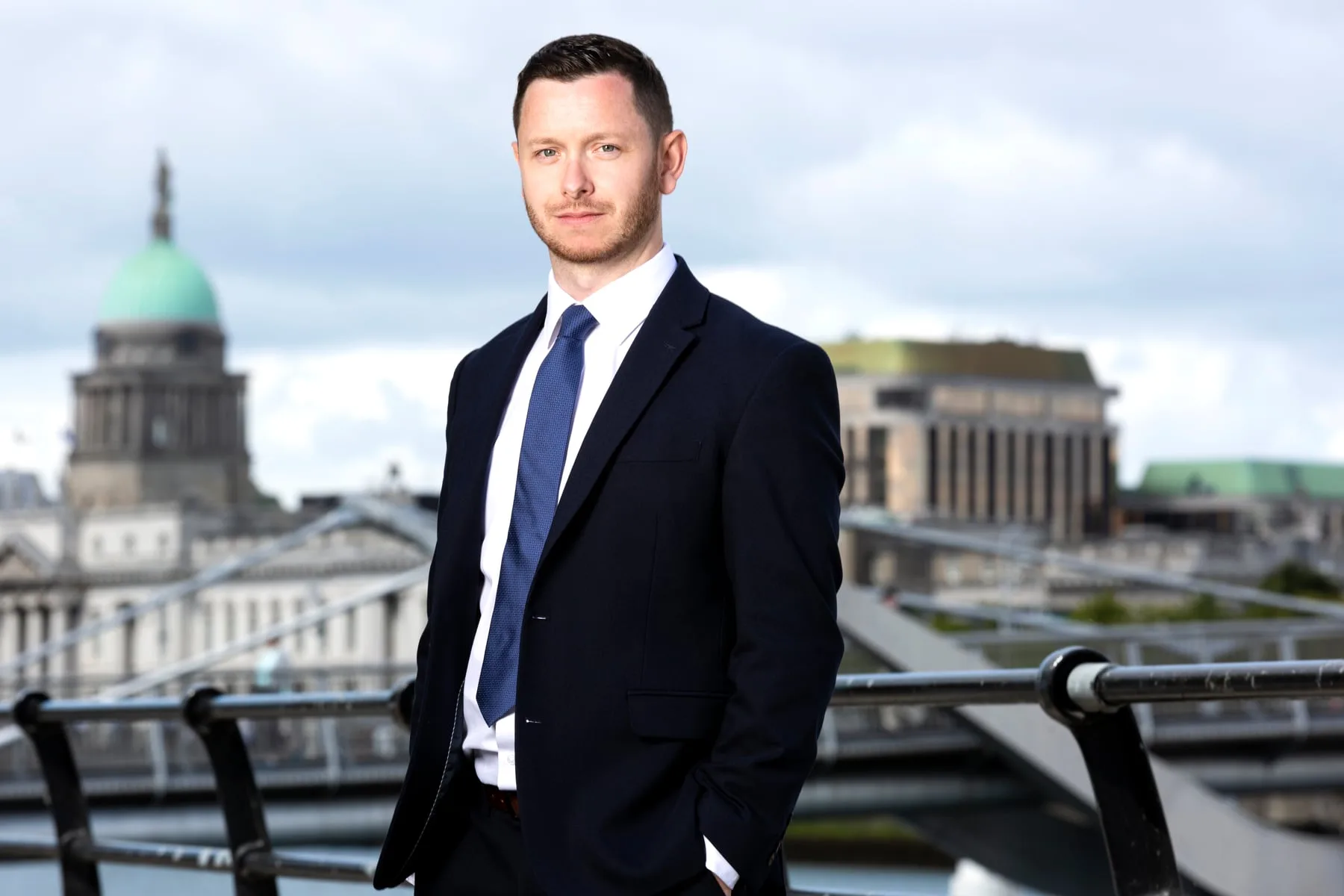 Executive portrait above the River Liffey, the Custom House behind, Dublin