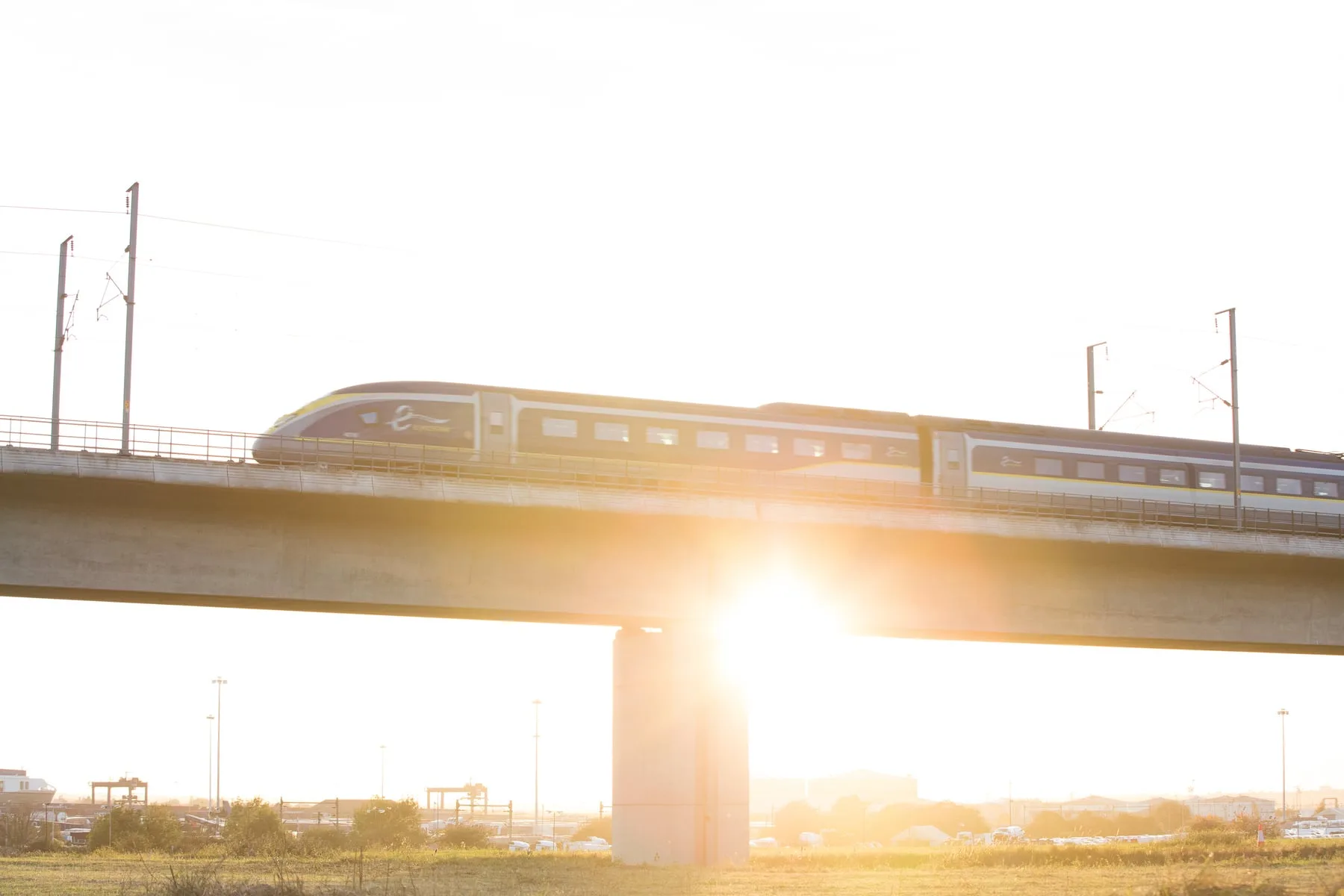 Eurostar train under a wide blue sky on the high-speed line
