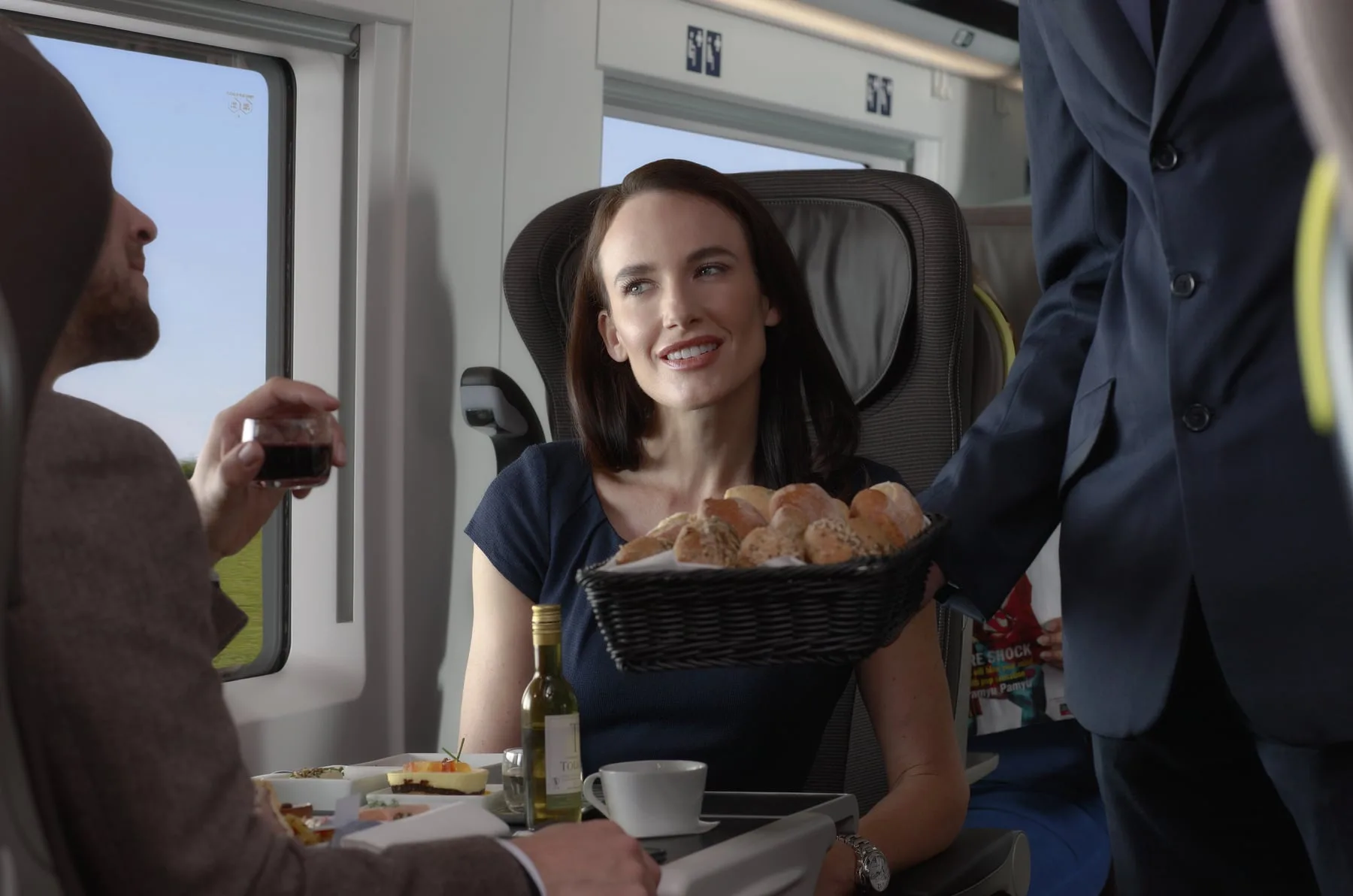 Eurostar at-seat dining, a steward offering a bread basket