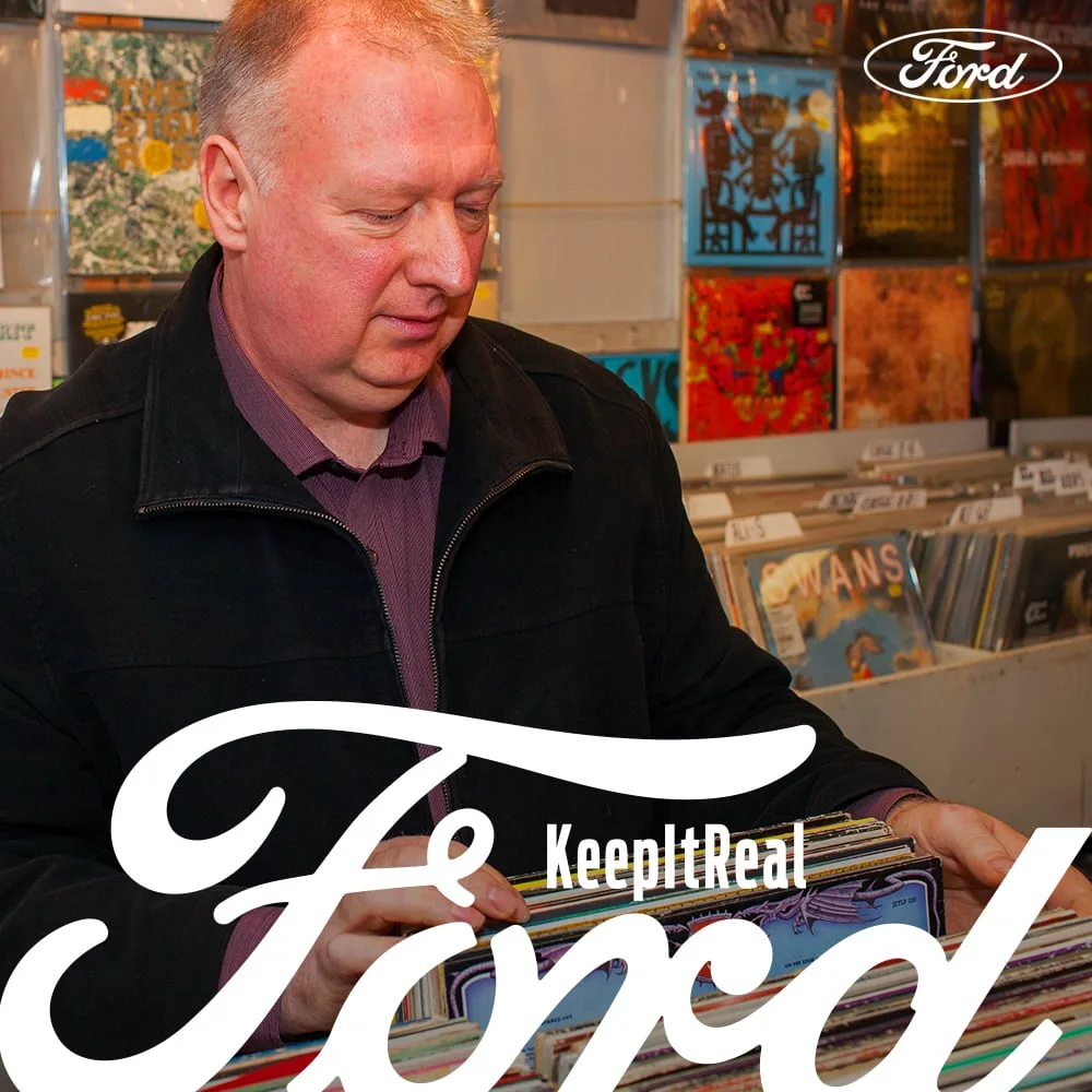 Ford Focus owner Kevin Wells flicking through vinyl in a record shop — Ford 'Keep It Real'