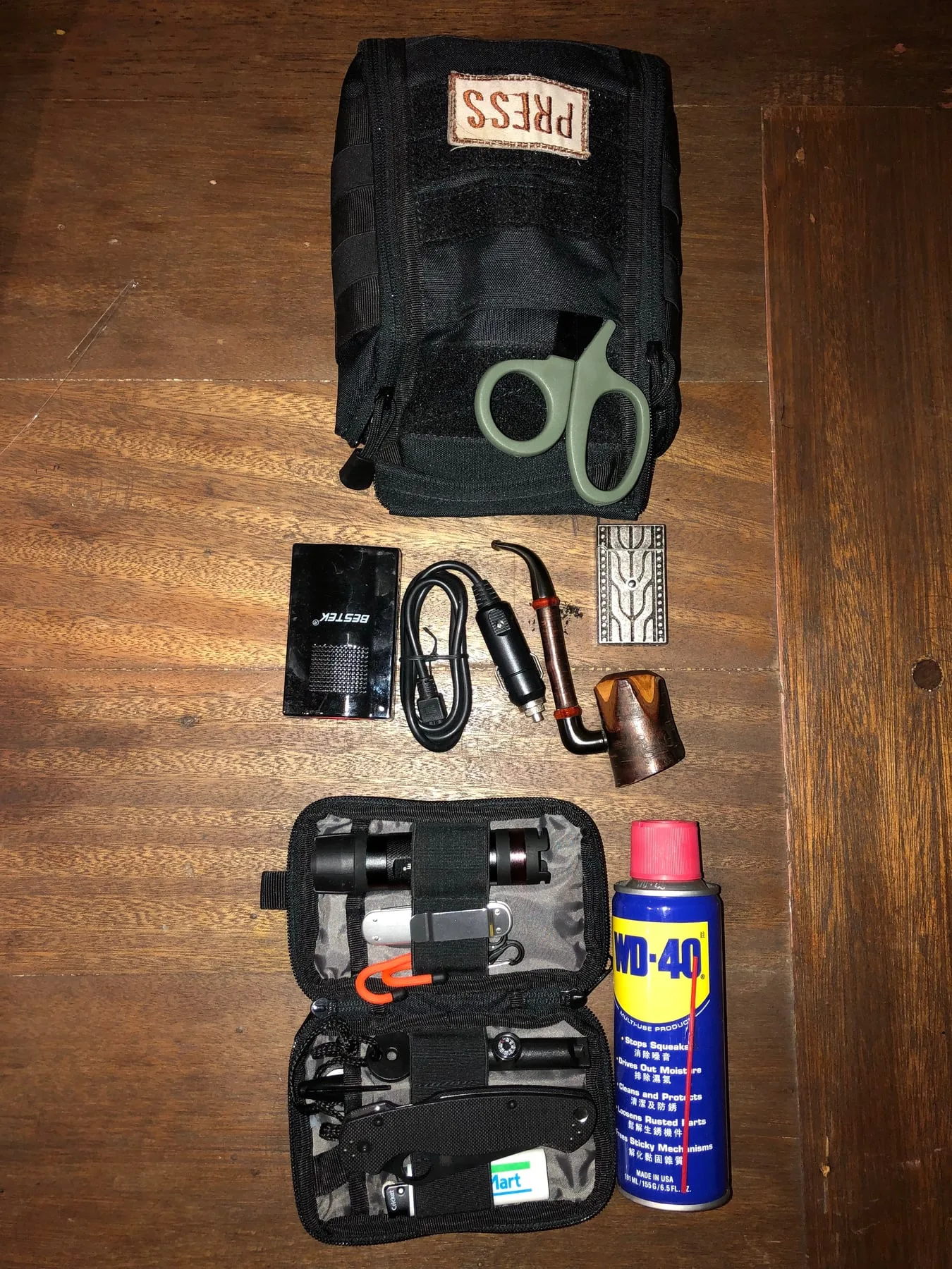 Veejay Villafranca's press glovebox — PRESS pouch, WD-40, survival kit — GoCompare, Manila