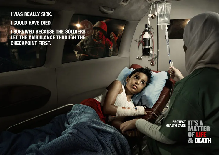 A sick child on an ambulance stretcher with an IV drip, carer at a checkpoint — ICRC 'Health Care in Danger' campaign