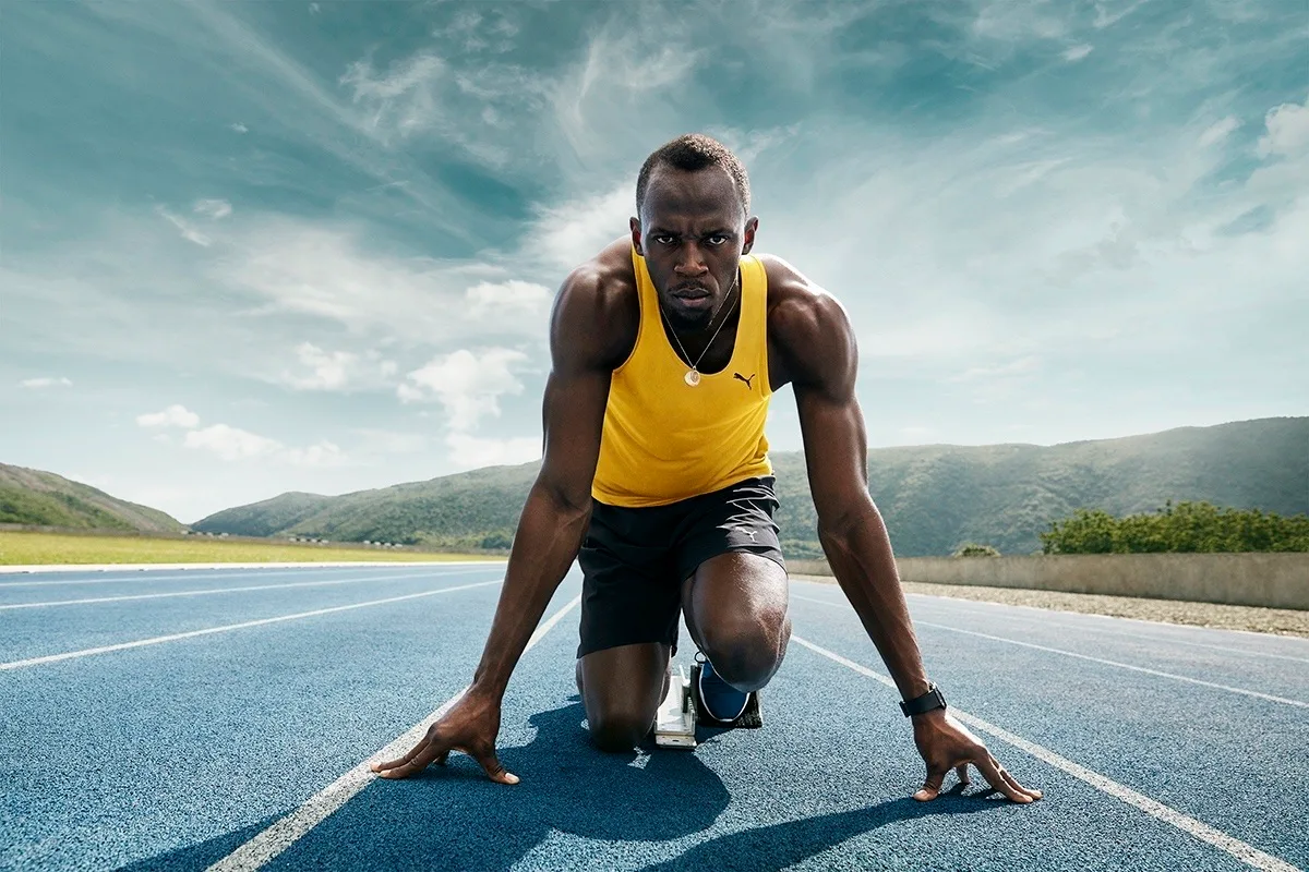 Usain Bolt in the set position at the blocks, Optus advertising