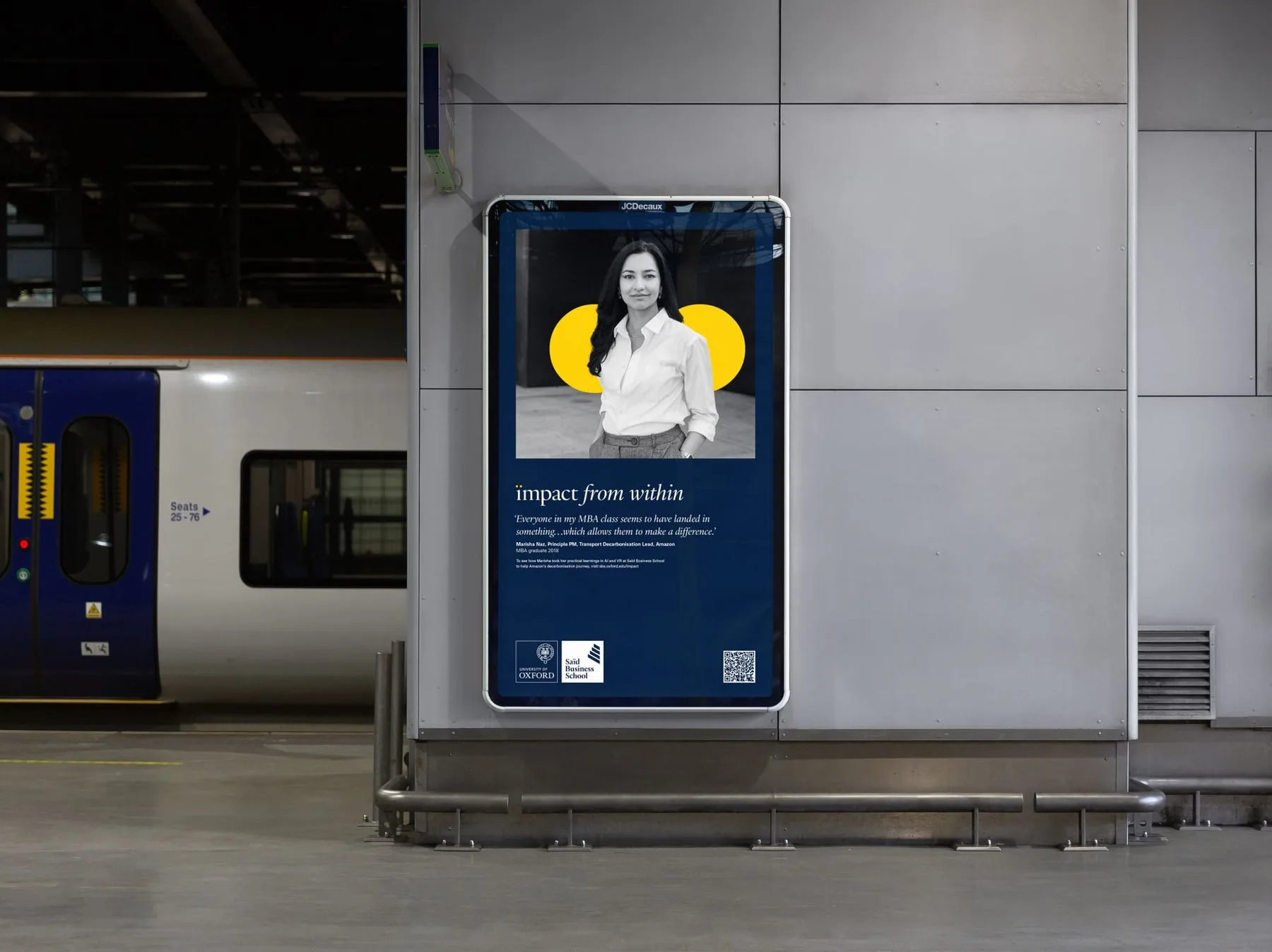 The Oxford Saïd 'Impact from Within' campaign running as a JCDecaux poster on a railway station platform, Marisha Naz of Amazon
